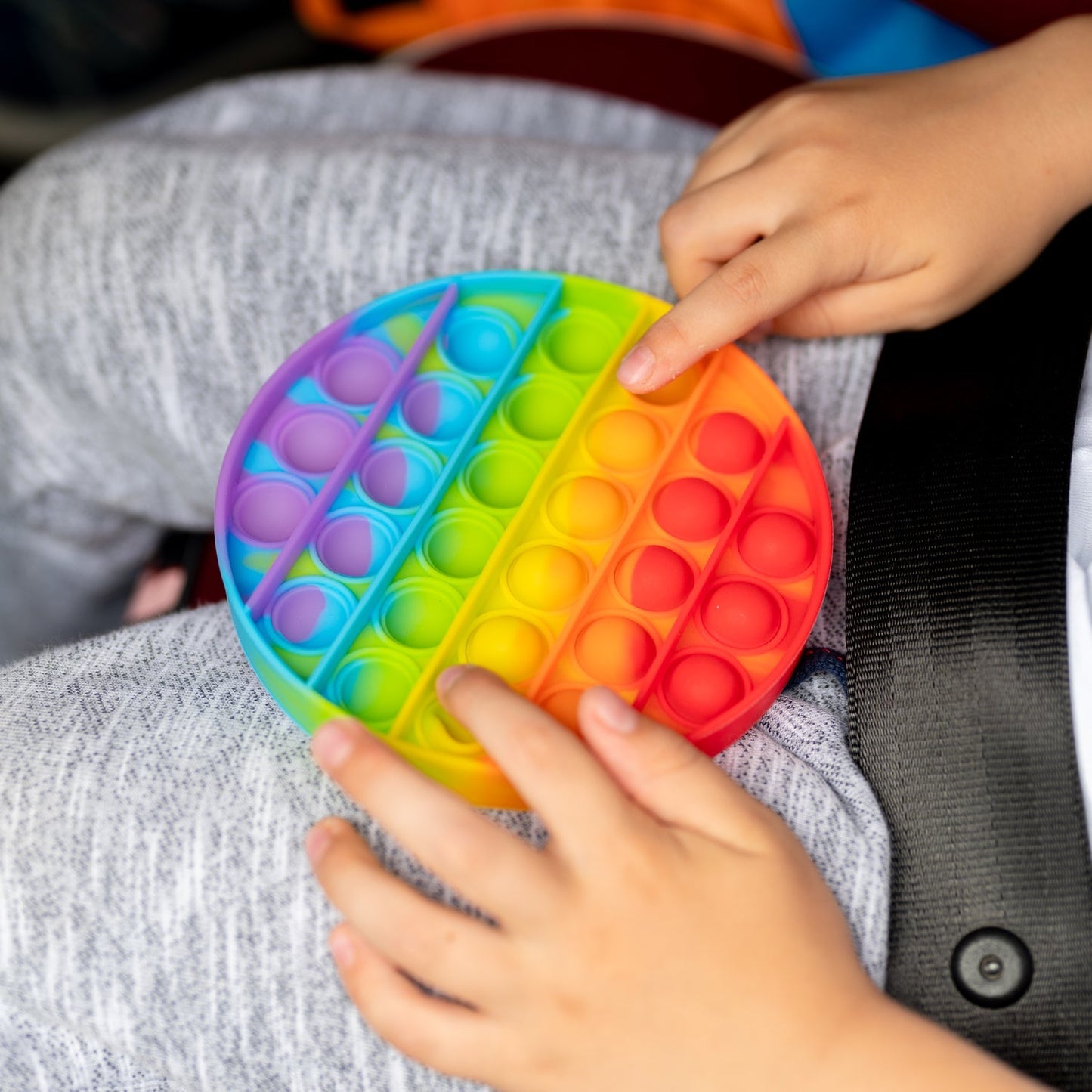 Round  it stress toy with colorful bubbles.